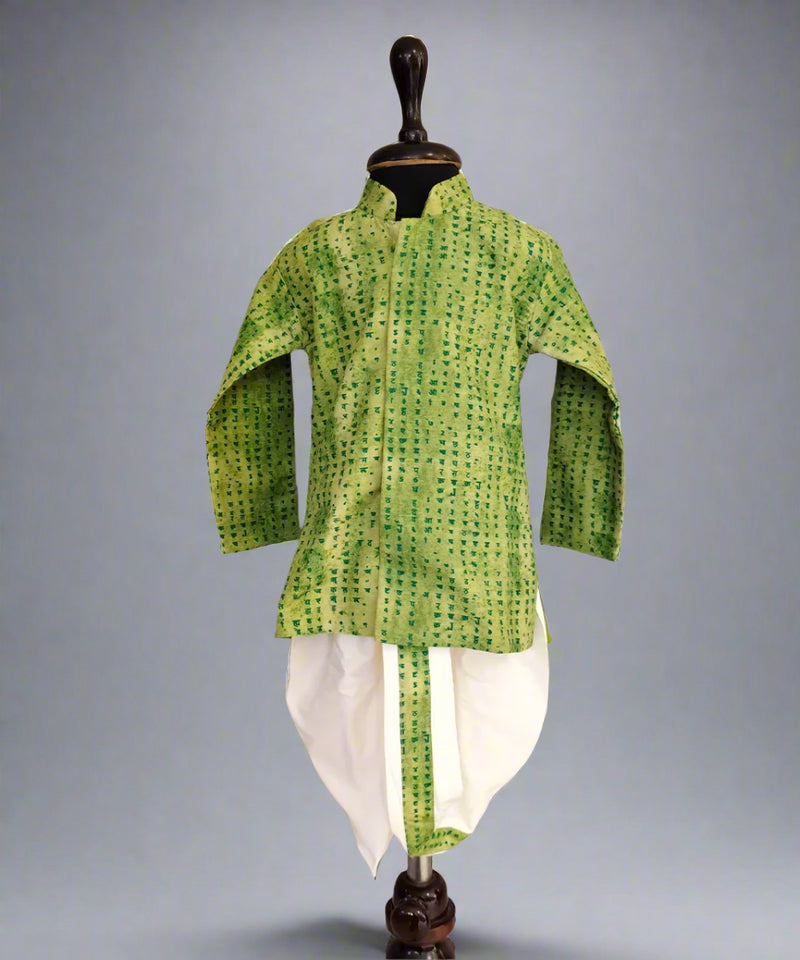 A green and white dotted dhoti-kurta set for boys displayed on a mannequin.