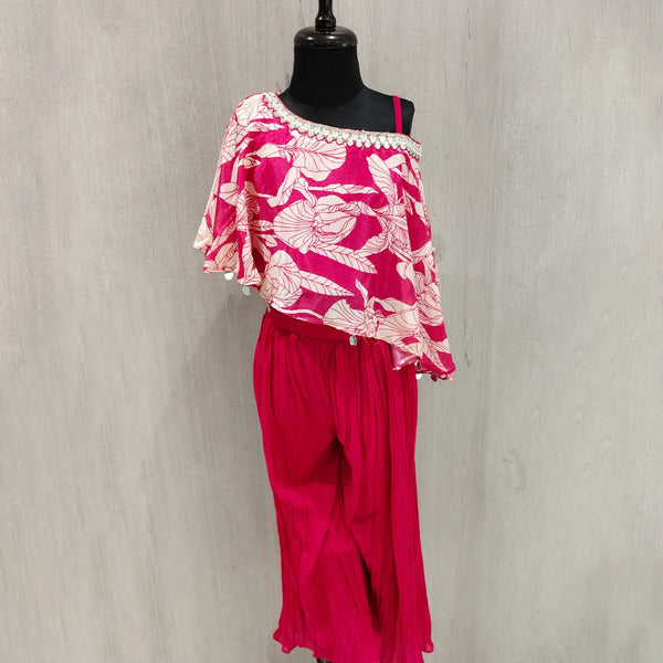 Mannequin wearing a pink floral top and pants against a gray background
