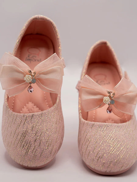 Infant girls’ pink glitter slip-on shoes with organza bow and floral embellishment, Jaipur