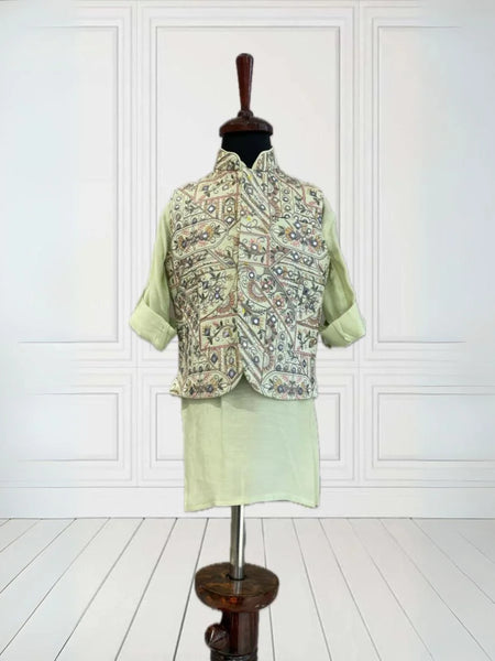  It's a pista green Colored kurta and pyjama teamed up with a beautiful embroidered waistcoat. It is the best boy's designer kurta-pyjama set.