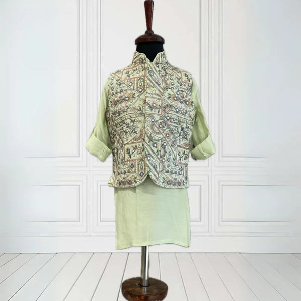  It's a pista green Colored kurta and pyjama teamed up with a beautiful embroidered waistcoat. It is the best boy's designer kurta-pyjama set.