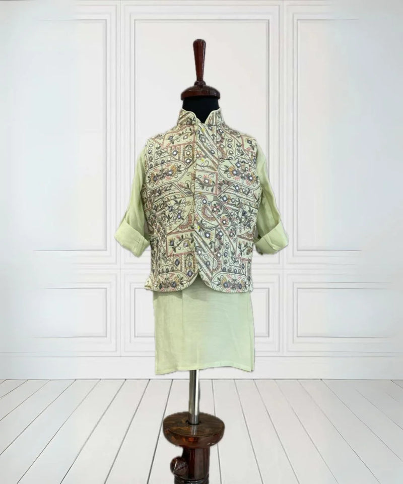  It's a pista green Colored kurta and pyjama teamed up with a beautiful embroidered waistcoat. It is the best boy's designer kurta-pyjama set.