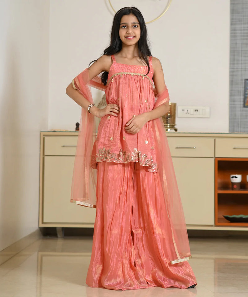 Jaipur festive girls' peach palazzo suit with flared pants and designer kurti

