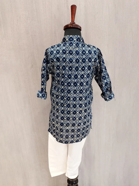 Blue patterned kurta on a mannequin against a beige background