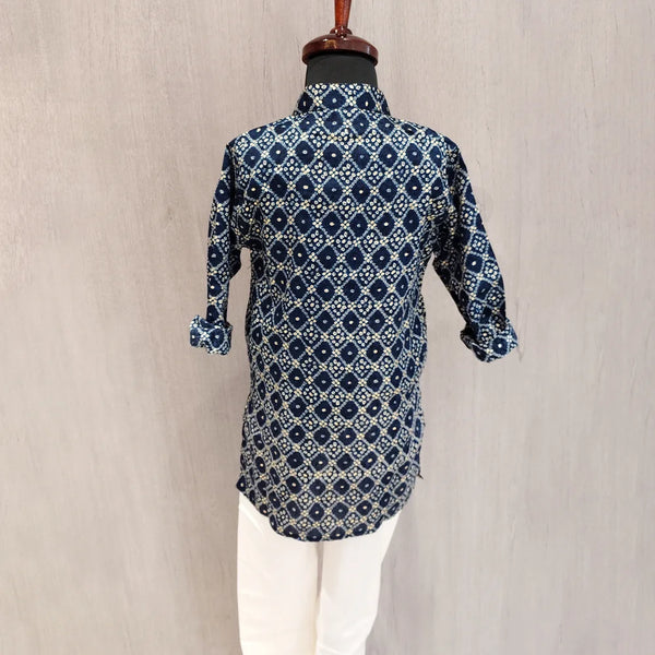 Blue patterned kurta on a mannequin against a beige background
