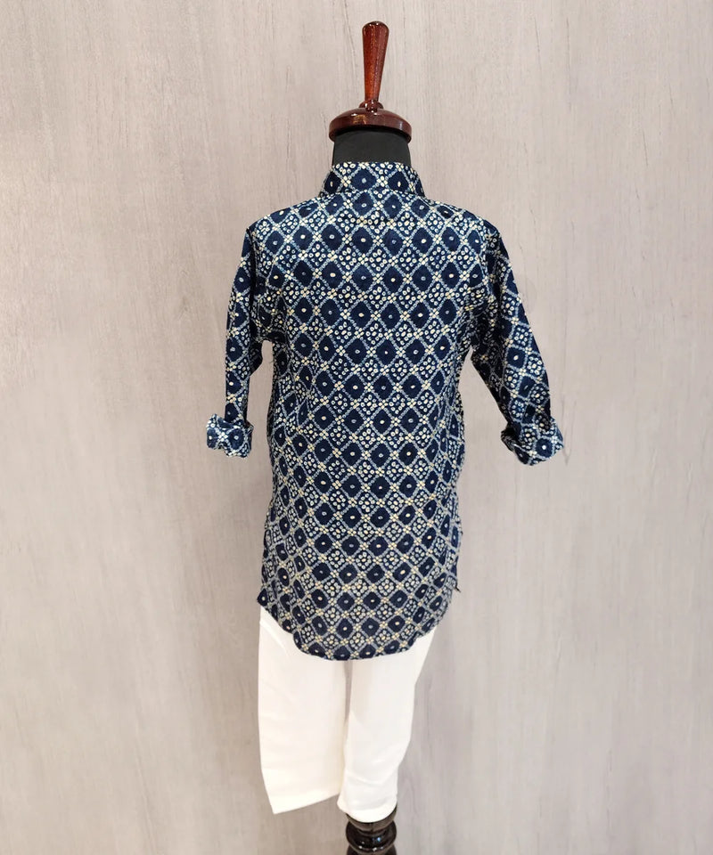 Blue patterned kurta on a mannequin against a beige background