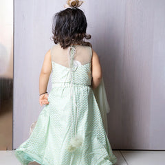 back view of pista green lehenga set for girls