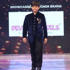 Boy wearing a navy blue jodhpuri suit 
