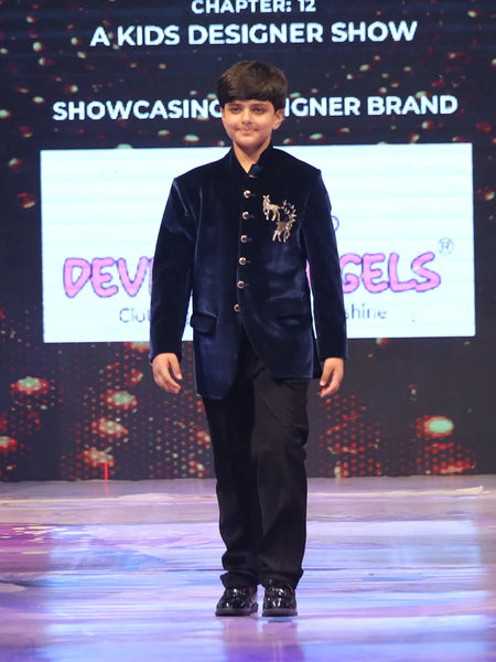 Boy wearing a navy blue jodhpuri suit 