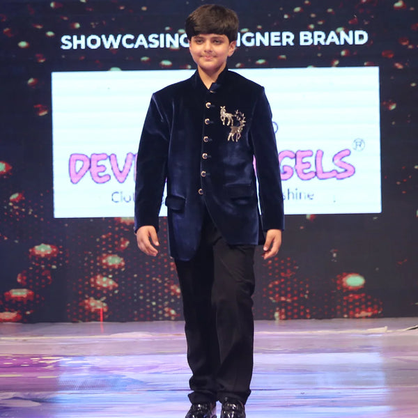 Boy wearing a navy blue jodhpuri suit 