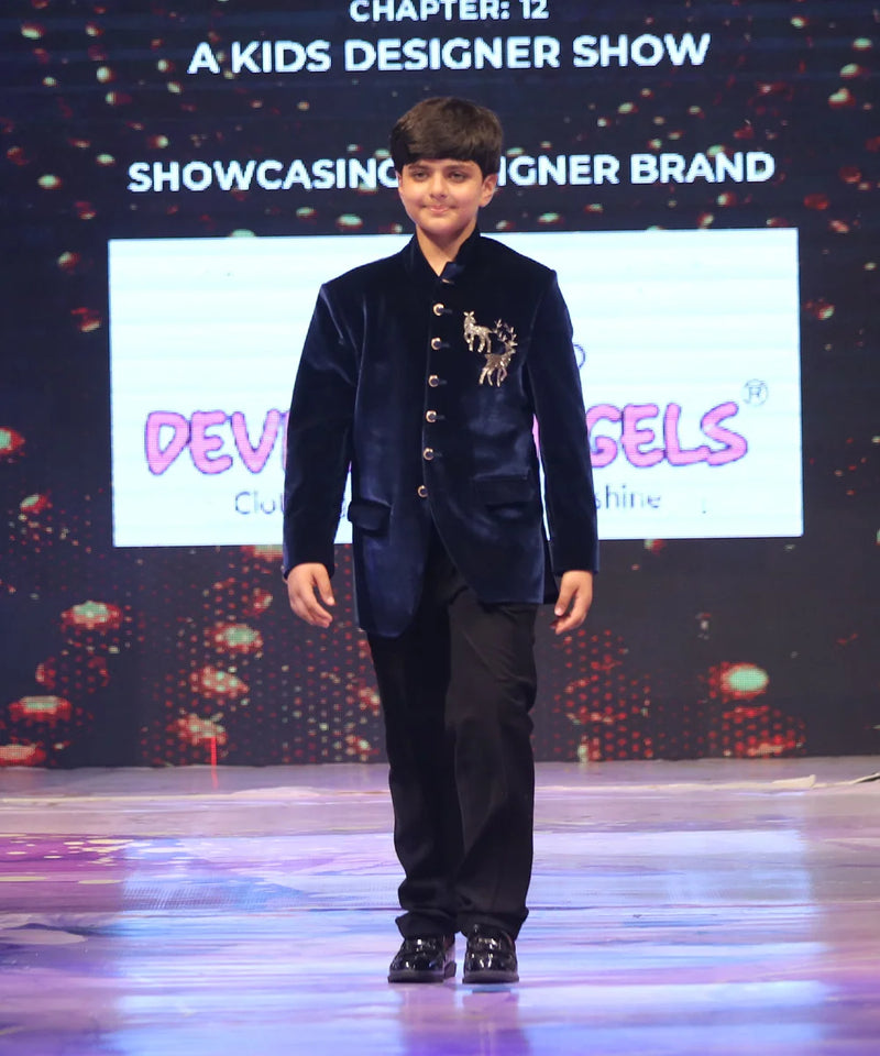 Boy wearing a navy blue jodhpuri suit 