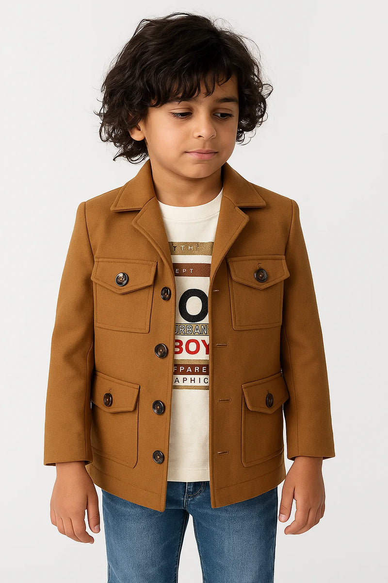 Child wearing a brown jacket over a graphic t-shirt on a white background
