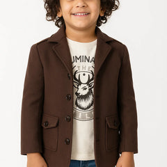 Child wearing a brown blazer over a graphic t-shirt on a white background