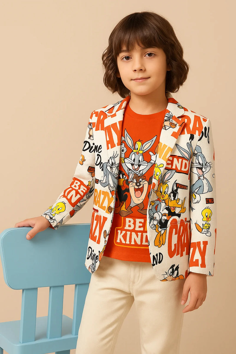 Child wearing a colorful jacket with cartoon characters and text, sitting on a blue chair against a beige background.