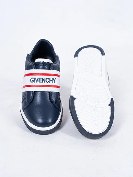 Close-up of boys' and girls' navy slip-on sneakers with white sole and red accent band, Jaipur

