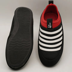 Close-up of kids' black and white striped sports sneakers with red detail, Jaipur.
