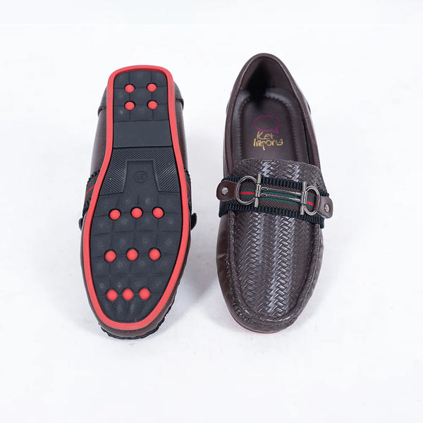 Close-up of trendy kids' brown party loafers with cushioned insole and red outsole, Jaipur