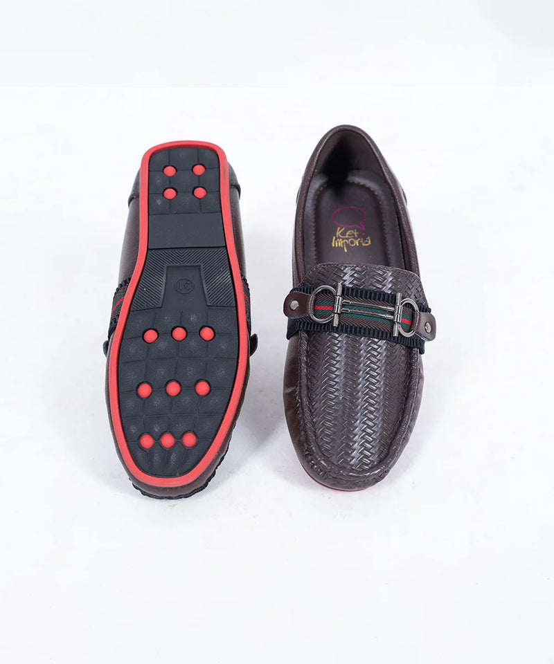 Close-up of trendy kids' brown party loafers with cushioned insole and red outsole, Jaipur