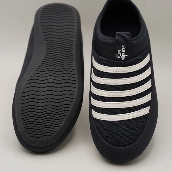 Close-up of kids' navy blue mesh sneakers with cushioned insole and white bands, Jaipur