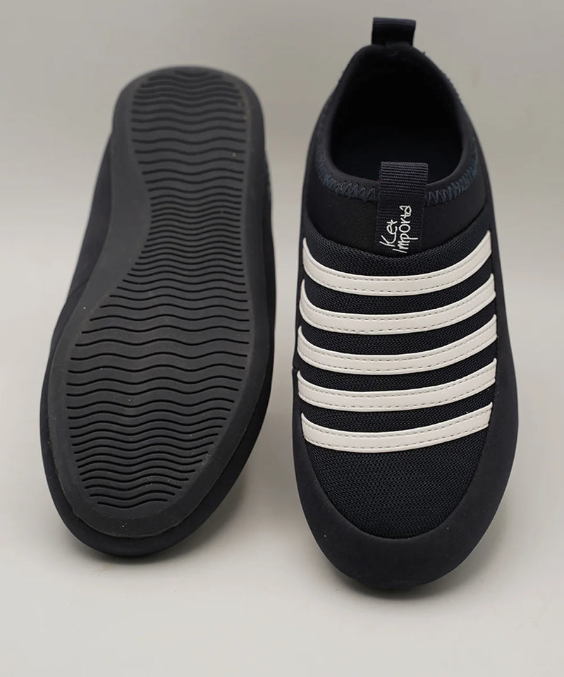 Close-up of kids' navy blue mesh sneakers with cushioned insole and white bands, Jaipur