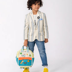 Child wearing a striped blazer with a colorful backpack on a white background