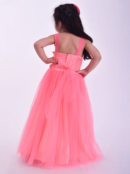 Young girl wearing a pink dress with a bow on a white background