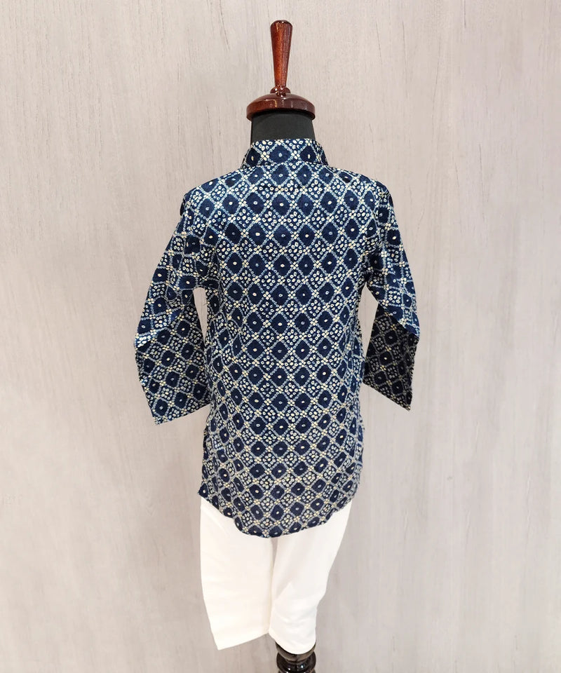 Blue patterned shirt on a mannequin against a beige background