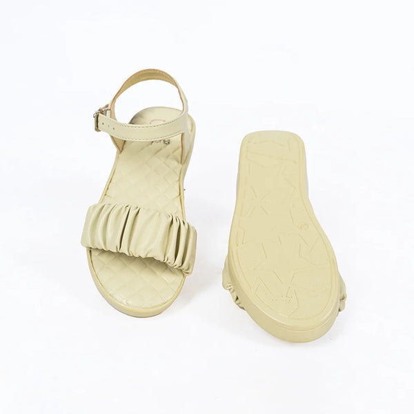 Close-up of trendy girls' beige flat sandals with quilted insole and adjustable strap, Jaipur