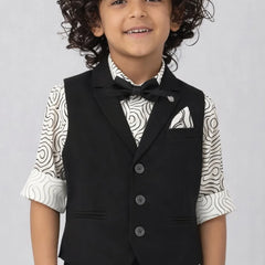 Child wearing a black vest over a patterned shirt on a plain background