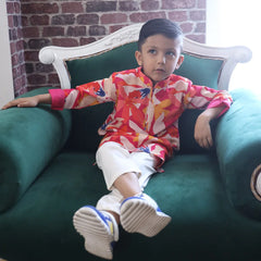 It is a multi-coloured printed kurta teamed up with a matching Pyjama for kids. It's the best boy's designer kurta-pyjama set.