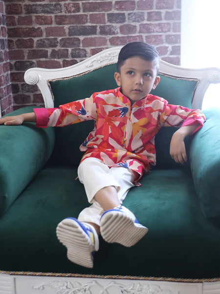 It is a multi-coloured printed kurta teamed up with a matching Pyjama for kids. It's the best boy's designer kurta-pyjama set.