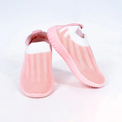 Close-up of trendy girls' pastel pink slip-on shoes with mesh upper, Jaipur