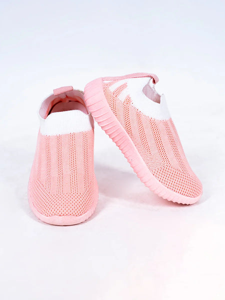 Close-up of trendy girls' pastel pink slip-on shoes with mesh upper, Jaipur