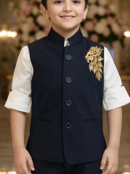 Child wearing a navy vest with gold embroidery in an indoor setting