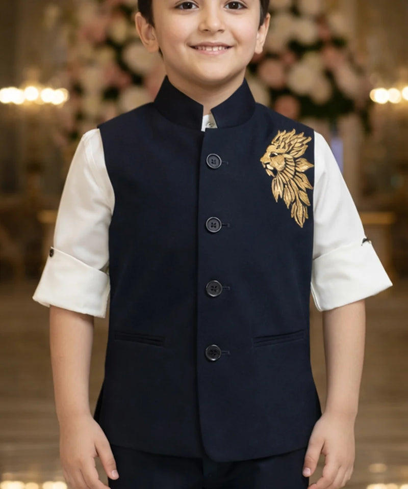 Child wearing a navy vest with gold embroidery in an indoor setting