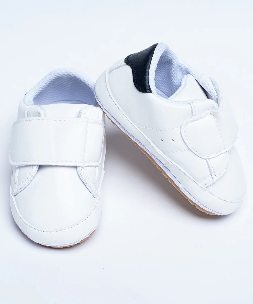 It's a pair of white sneakers for kids that has regular styling.