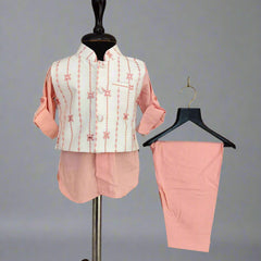 Pink and white outfit with jacket and pants on a mannequin and hanger against a gray background