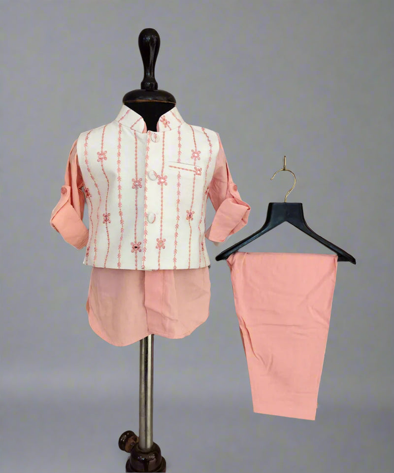 Pink and white outfit with jacket and pants on a mannequin and hanger against a gray background