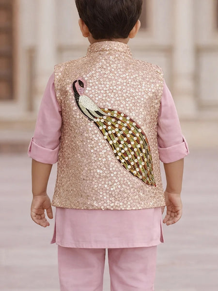 Child wearing a traditional outfit with a sequined vest and pink shirt and pants.