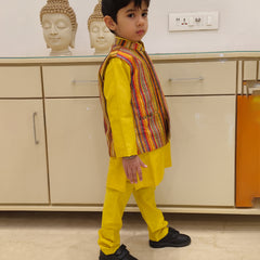 This is side look of yellow color plain kurta pajama with multi color stripe jacket