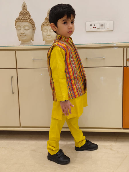 This is side look of yellow color plain kurta pajama with multi color stripe jacket