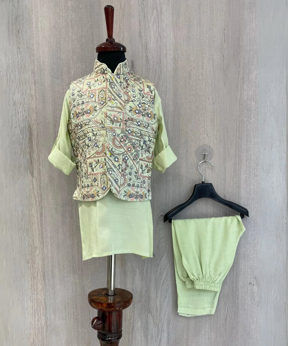  It's a pista green Colored kurta and pyjama teamed up with a beautiful embroidered waistcoat. It is the best boy's designer kurta-pyjama set.