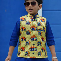 Child wearing a colorful vest over a blue shirt against a blue background