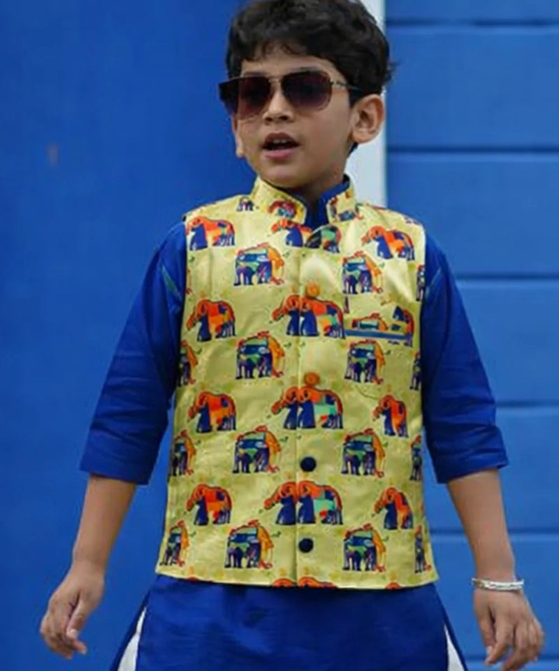Child wearing a colorful vest over a blue shirt against a blue background
