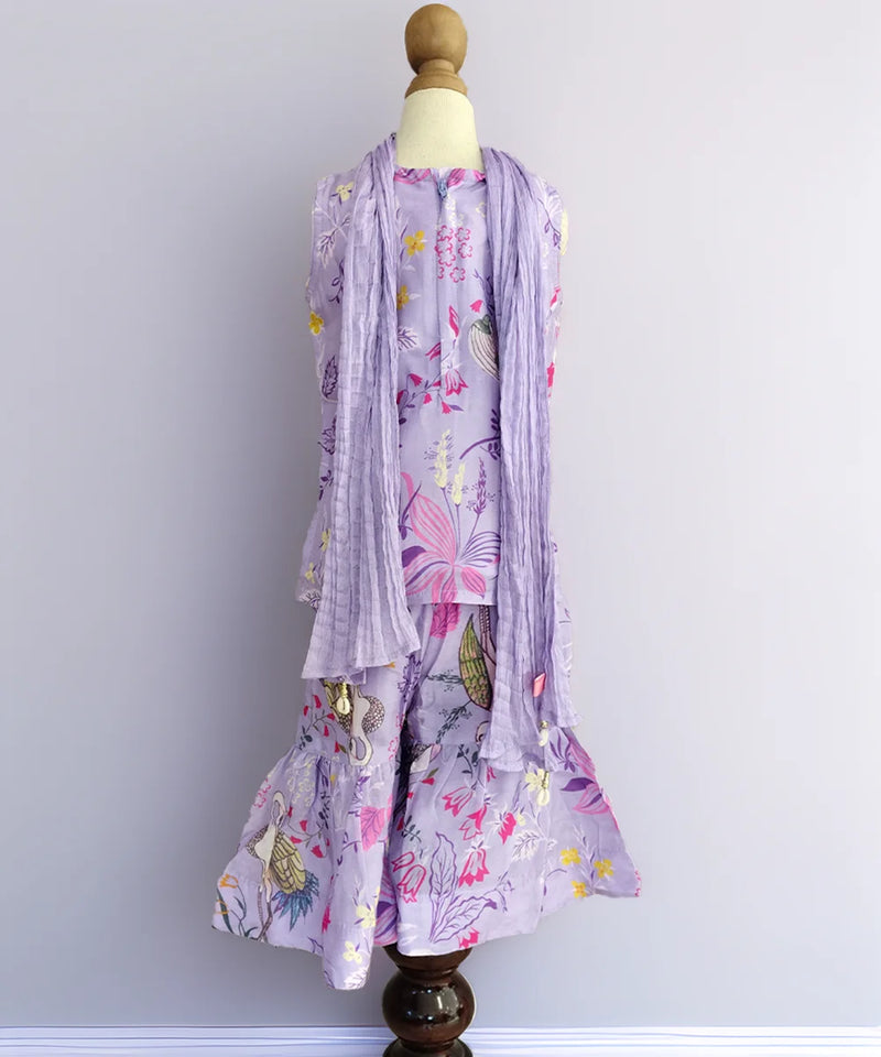 Floral dress with matching scarf on a mannequin against a plain background