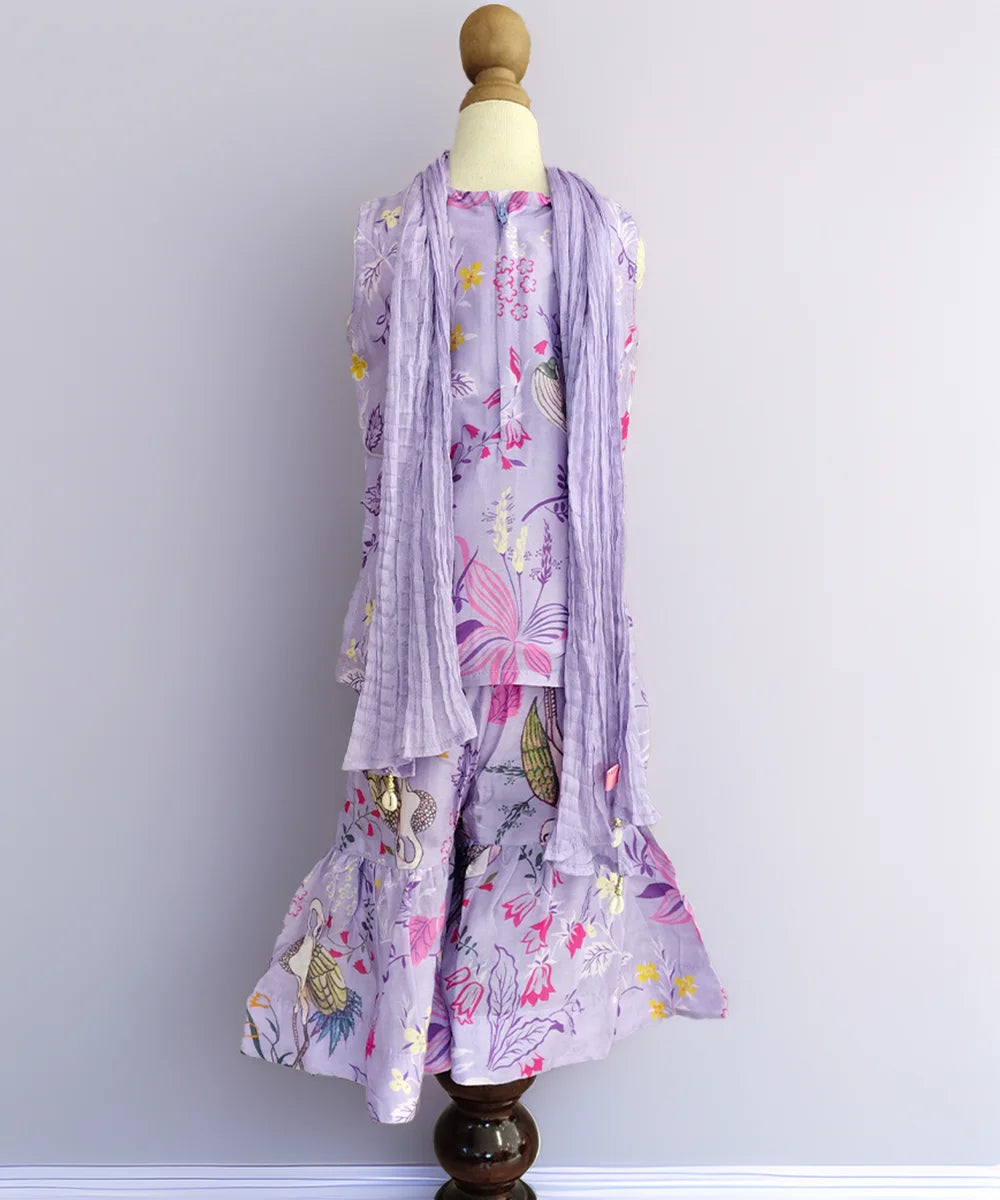 Floral dress with matching scarf on a mannequin against a plain background