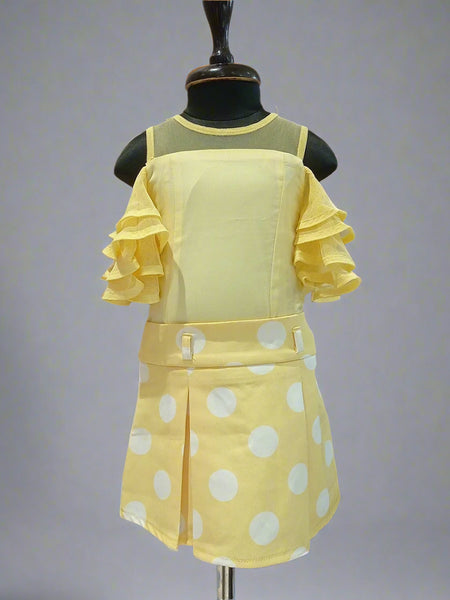 This outfit consists of a top and a Polka dotted box pleat skirt. It has net layer sleeves and zip closure on the top and skirt.