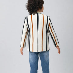 Child wearing a striped blazer over a graphic t-shirt on a plain background