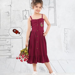 It is a Maroon Colored birthday girl frock that comes with a front button closure for girls. It features beautiful floral basket embroidery on the dress.