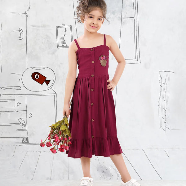 It is a Maroon Colored birthday girl frock that comes with a front button closure for girls. It features beautiful floral basket embroidery on the dress.
